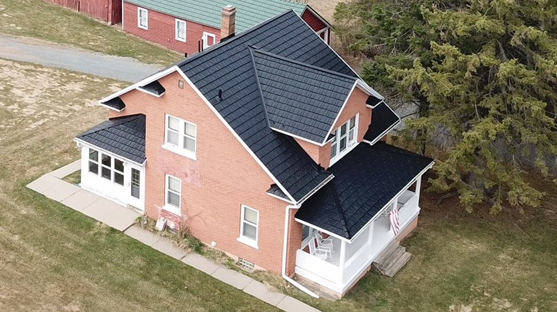 Black Rustic Shingle Roof on a Red Brick House