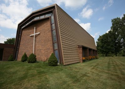 Brown Brick Church with a Brown Metal Roof