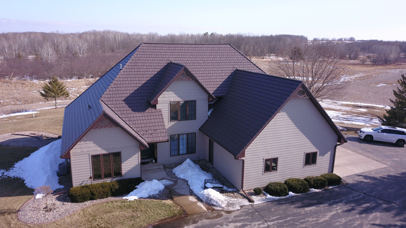 Brown Rustic Shingle Roof on a Tan House