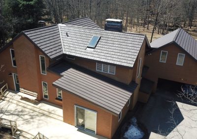Brown Home with Brown Standing Seam Roof