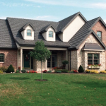 Brick Home with Black Country Manor Shake Metal Roof