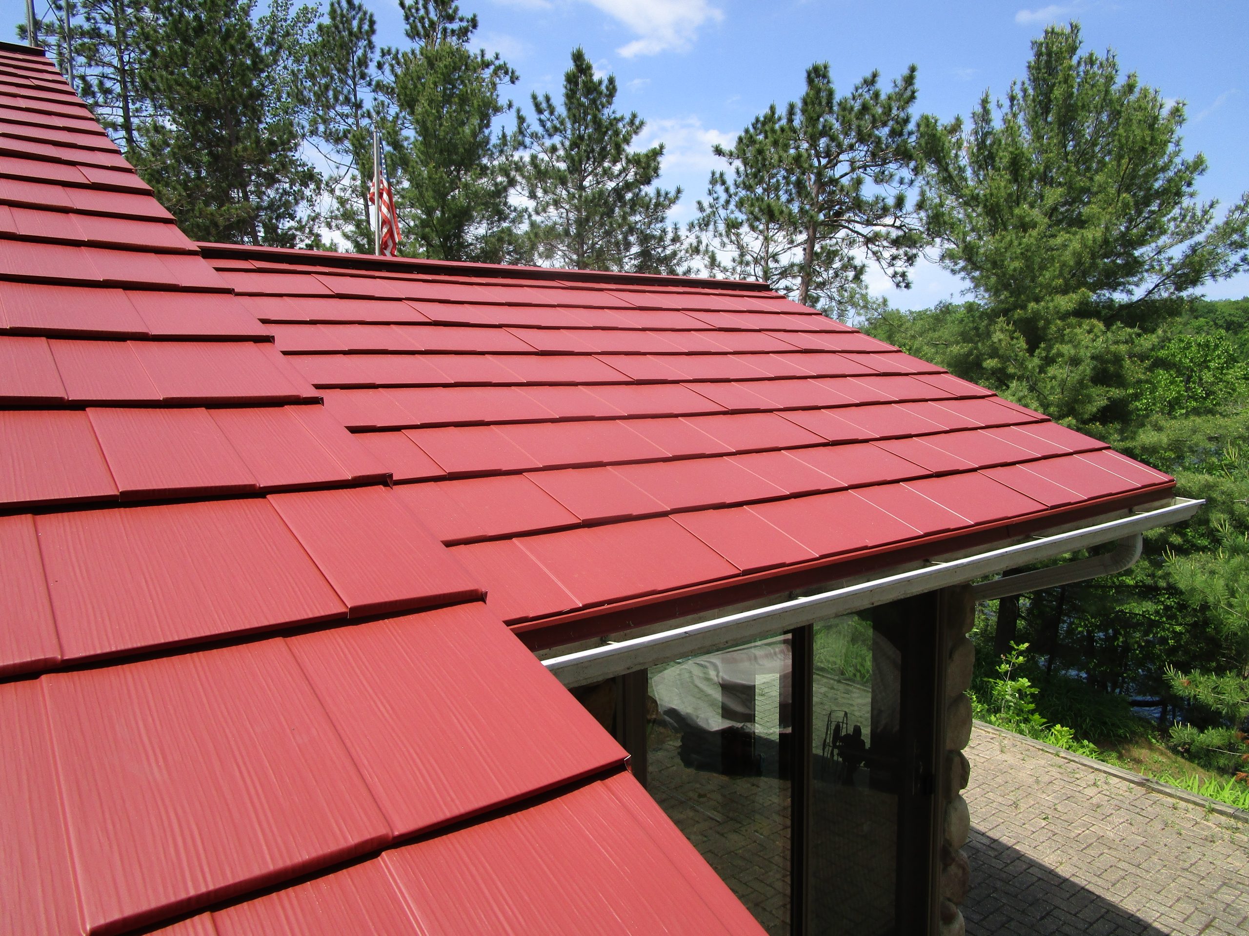 Up close view of red Oxford Metal Shingles