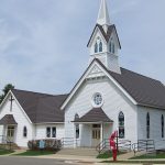 Metal Shingle Roof on a Beautiful White Church with Steeple