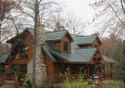 Green Country Manor Shake Metal Roof on a House in the Woods