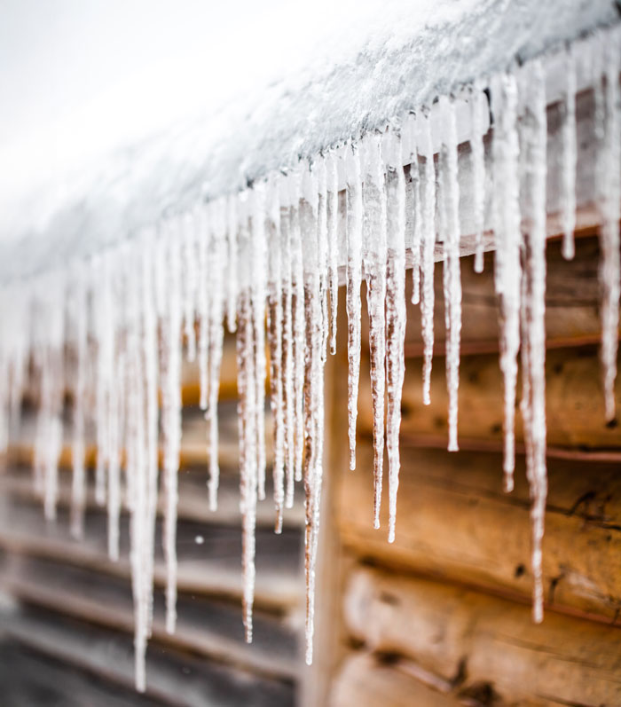 Long Icicles Melting of a roof top