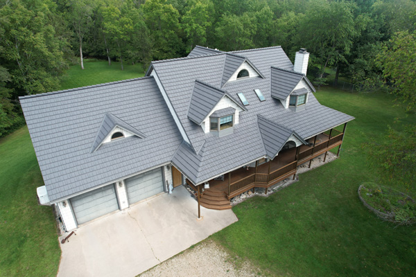 Gray metal roof on a white house