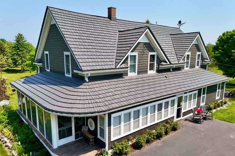 Brown house with rustic metal shingle roof